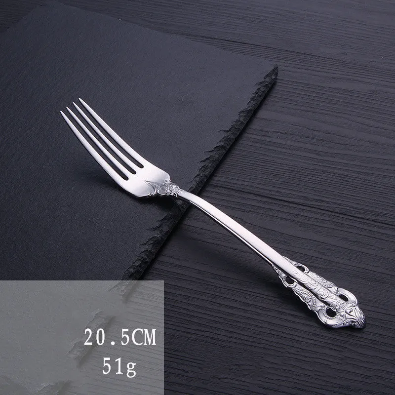 Stainless steel cutlery set with main knife, main fork, main spoon, and teaspoon in silver finish