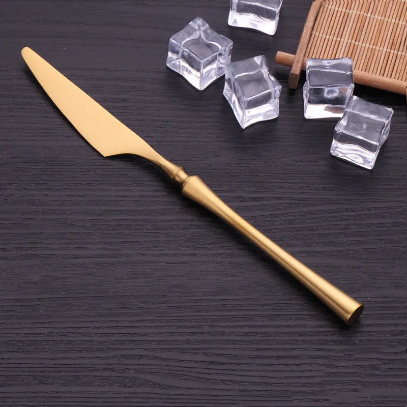 Stainless steel cutlery set with main knife, main fork, main spoon, and teaspoon in silver finish