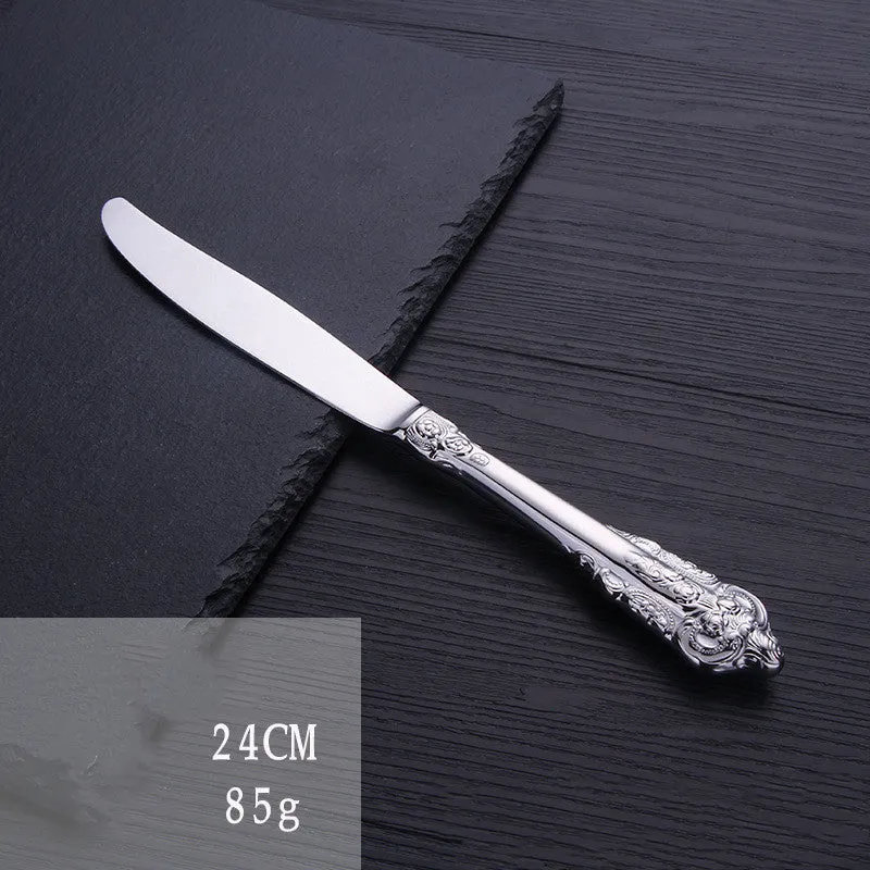 Stainless steel cutlery set with main knife, main fork, main spoon, and teaspoon in silver finish