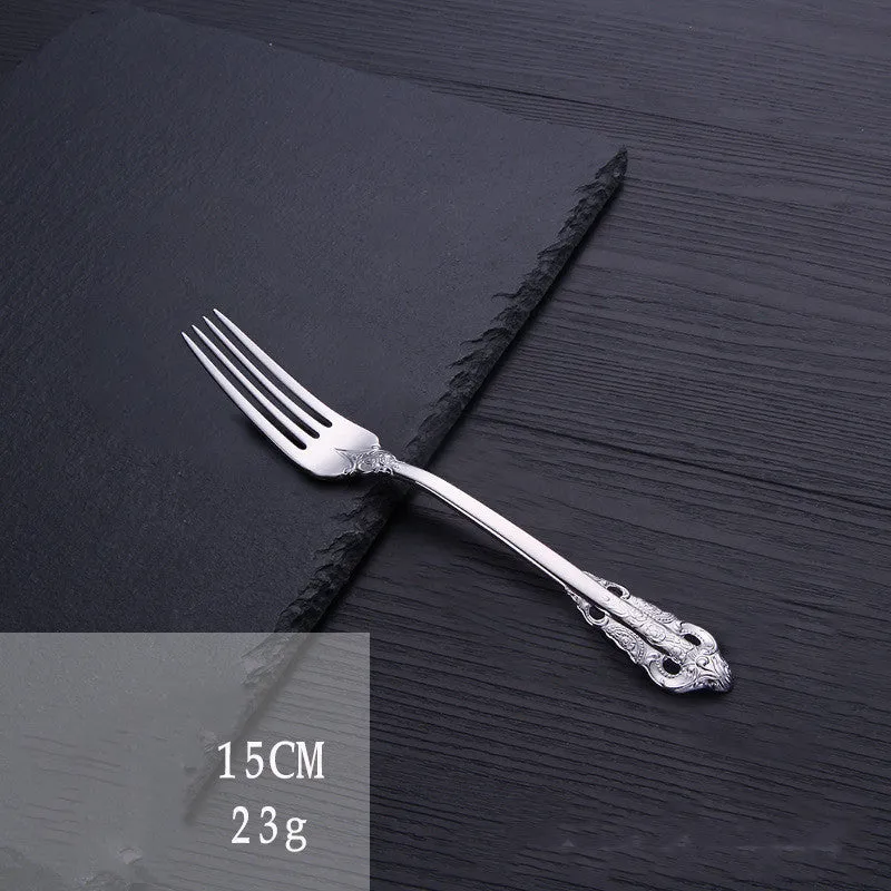 Stainless steel cutlery set with main knife, main fork, main spoon, and teaspoon in silver finish