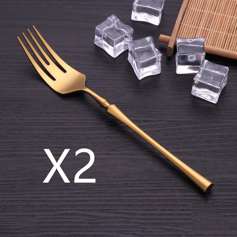 Stainless steel cutlery set with main knife, main fork, main spoon, and teaspoon in silver finish