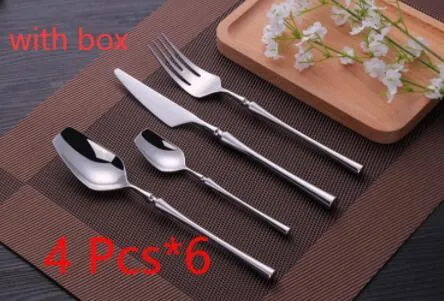 Stainless steel cutlery set with main knife, main fork, main spoon, and teaspoon in silver finish