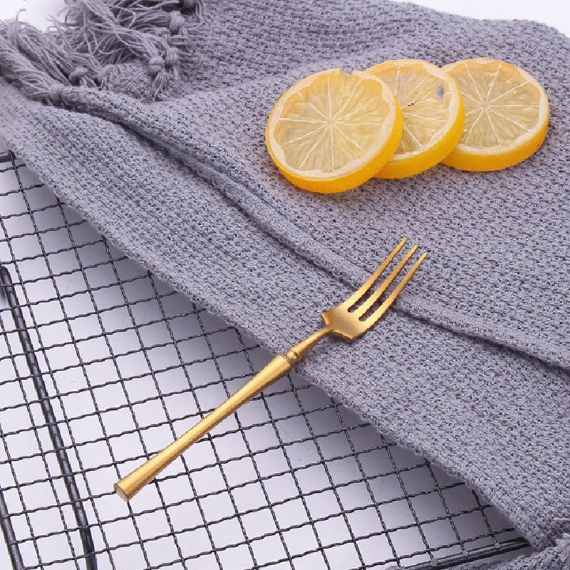 Stainless steel cutlery set with main knife, main fork, main spoon, and teaspoon in silver finish