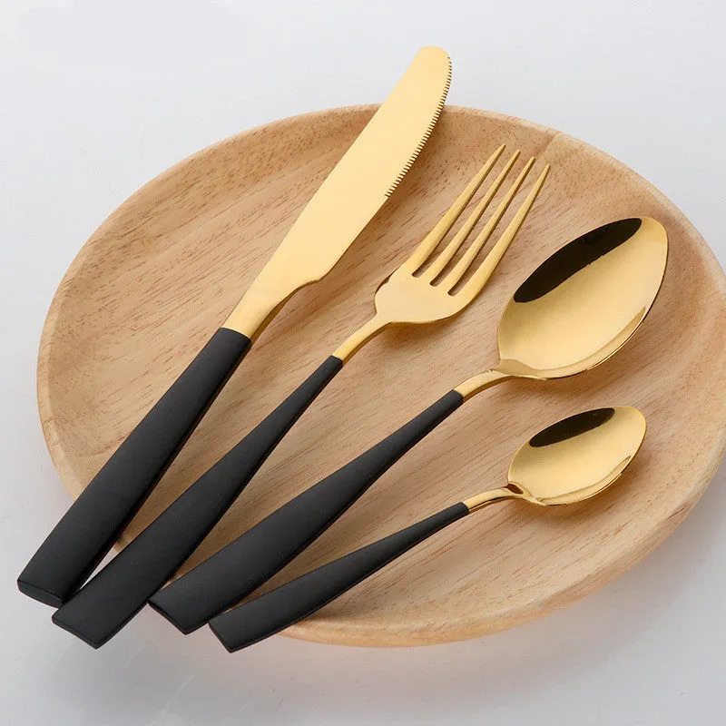 Four-piece stainless steel cutlery set in black with mirror polished finish