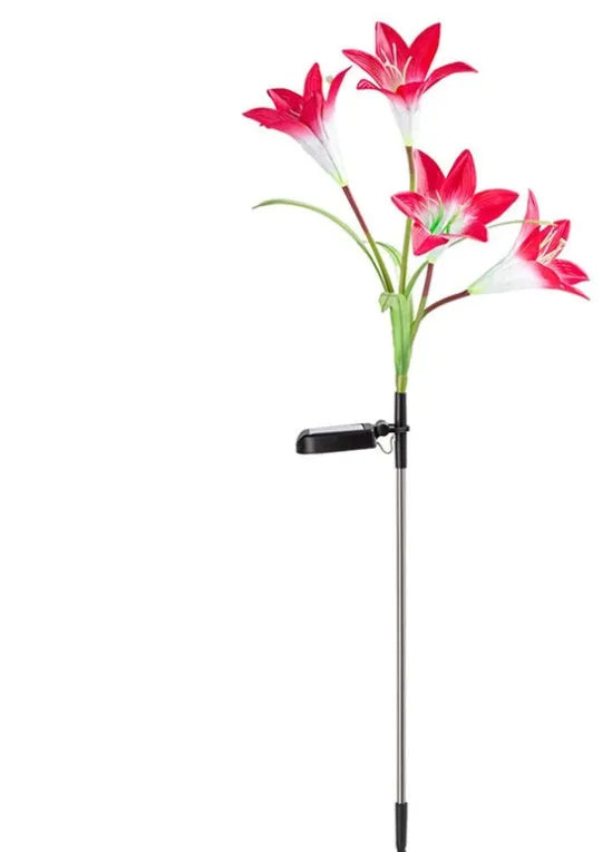 Solar lily flower light with silk cloth head, colour-changing LEDs, and stainless steel stake in a garden setting
