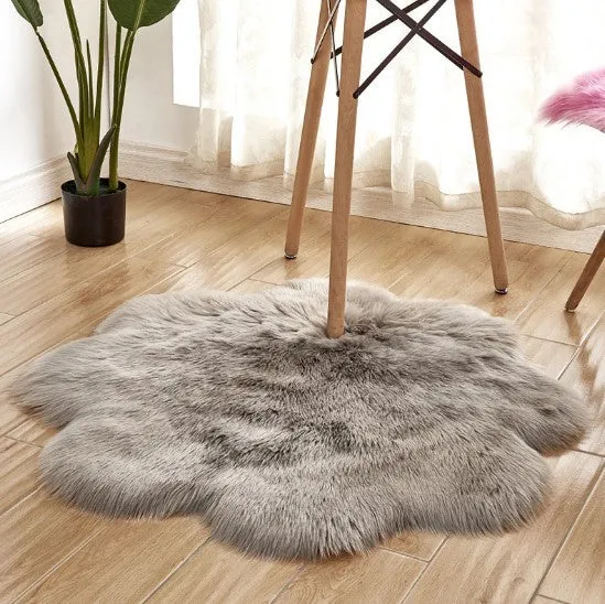 Artificial woolen floral sheepskin hairy plush carpet rug in beige colour, 60x60 cm size, on a tiled floor