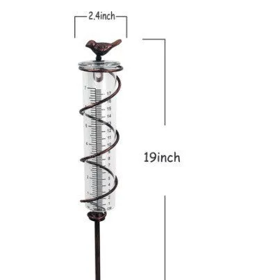 Glass rain gauge with cast iron hummingbird base for outdoor garden rainfall measurement.