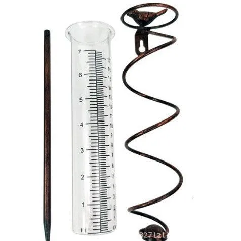 Glass rain gauge with cast iron hummingbird base for outdoor garden rainfall measurement.