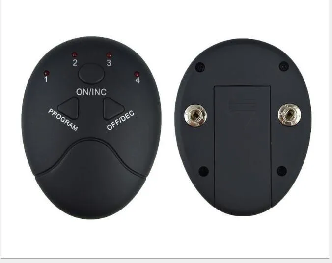 Black EMS muscle stimulator with electrode pads placed on abdomen for slimming and toning