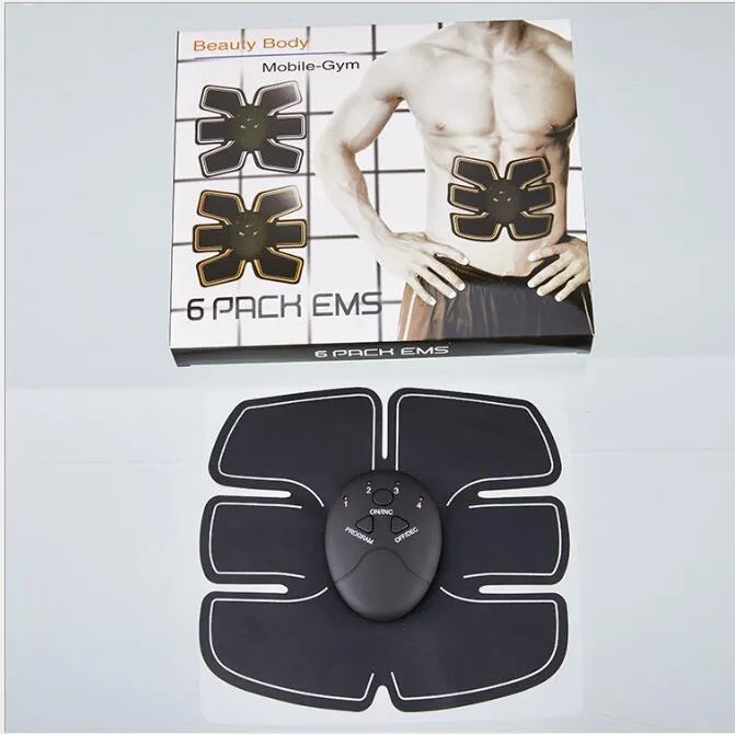 Black EMS muscle stimulator with electrode pads placed on abdomen for slimming and toning