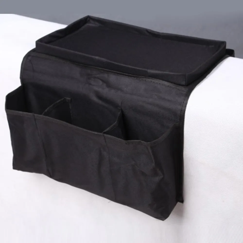 Black Oxford fabric sofa armrest organiser bag with 6 pockets on a couch handrail