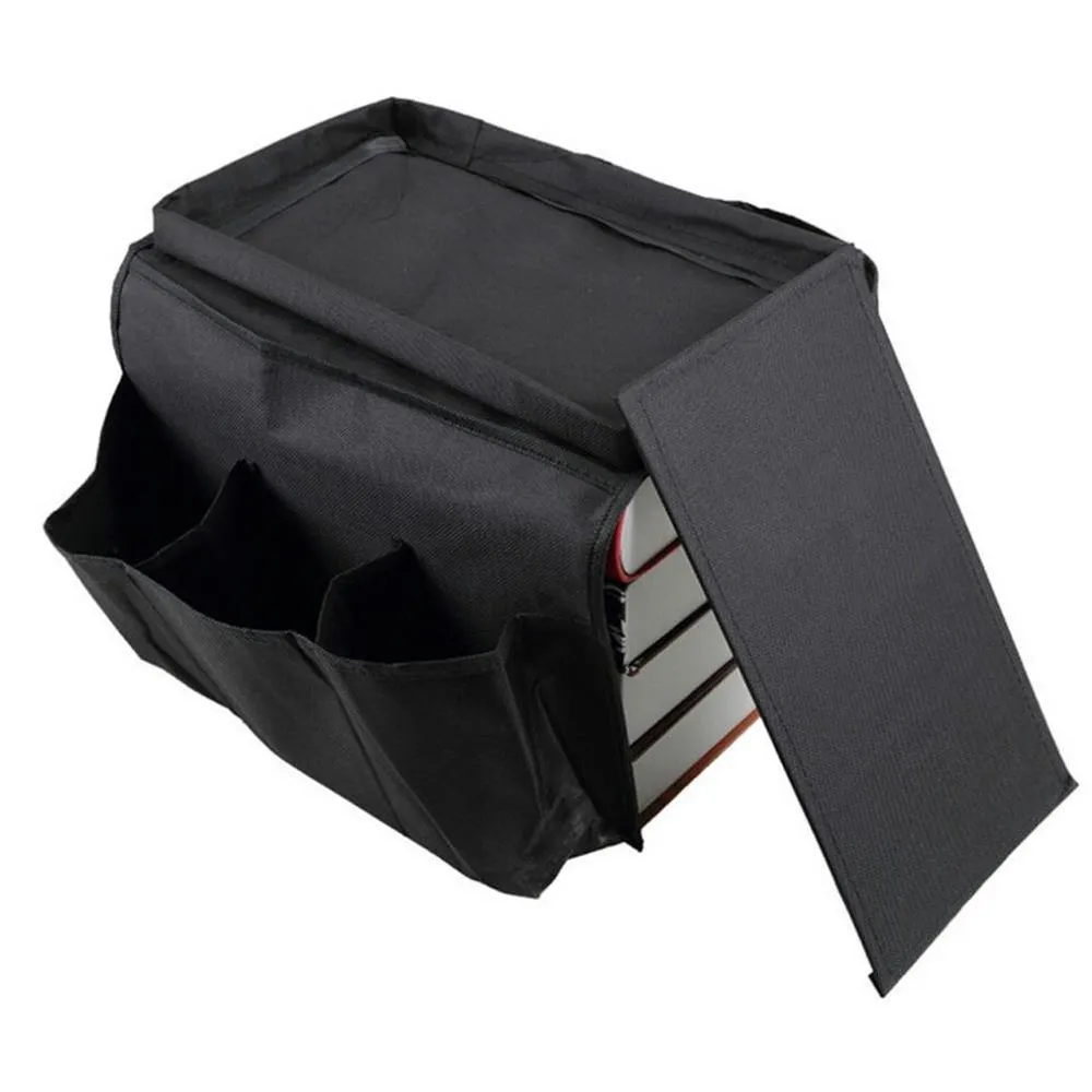 Black Oxford fabric sofa armrest organiser bag with 6 pockets on a couch handrail