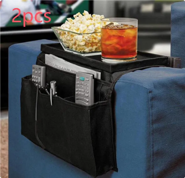 Black Oxford fabric sofa armrest organiser bag with 6 pockets on a couch handrail