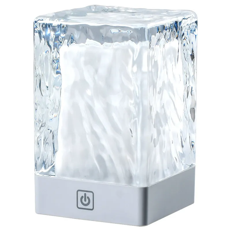 Compact crystal lamp 80x80x12mm with touch sensor and USB cable on a wooden desk