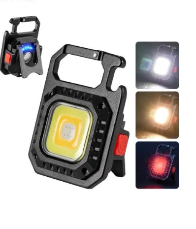 Black multifunctional portable LED torch with aluminium alloy body, magnet base, and control button on a wooden surface