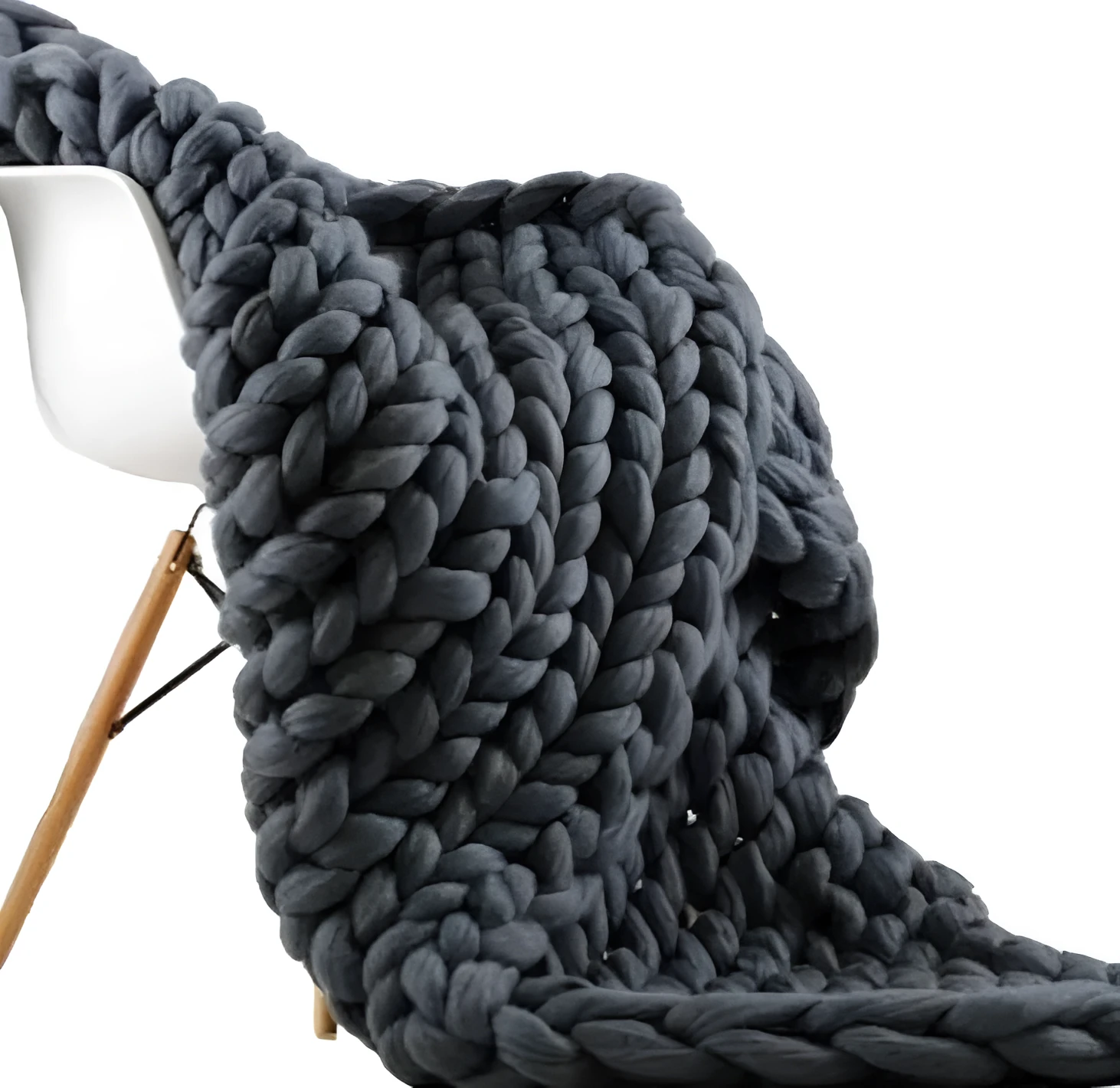 Hand woven chenille blanket in dark grey colour draped over a sofa, available in multiple sizes