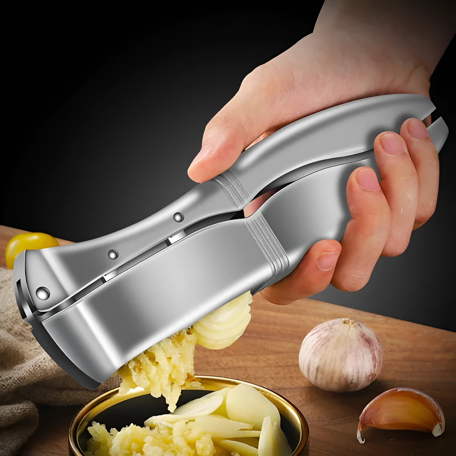 Manual garlic press aluminium alloy silver colour 20cm length on kitchen countertop