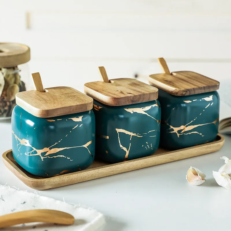 Nordic gold marble ceramic jar set with wooden tray and bamboo spoon on a kitchen counter