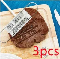 Silver aluminium alloy BBQ branding iron with 55 letters and 8 spaces for personalised meat stamping on a wooden surface