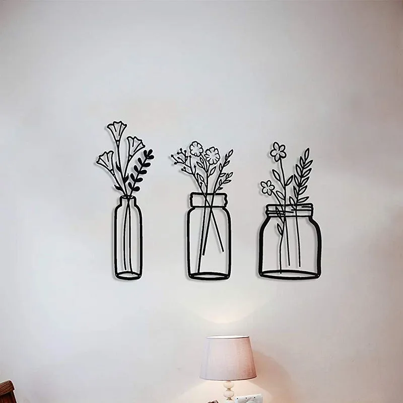 Black iron flower silhouette wall decoration, 40x19 cm, with wall mount on neutral wall