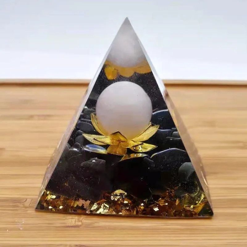 Black resin pyramid ornament 60x60mm on a white surface with white square paper box packaging