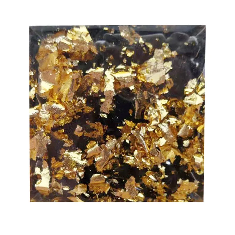 Black resin pyramid ornament 60x60mm on a white surface with white square paper box packaging