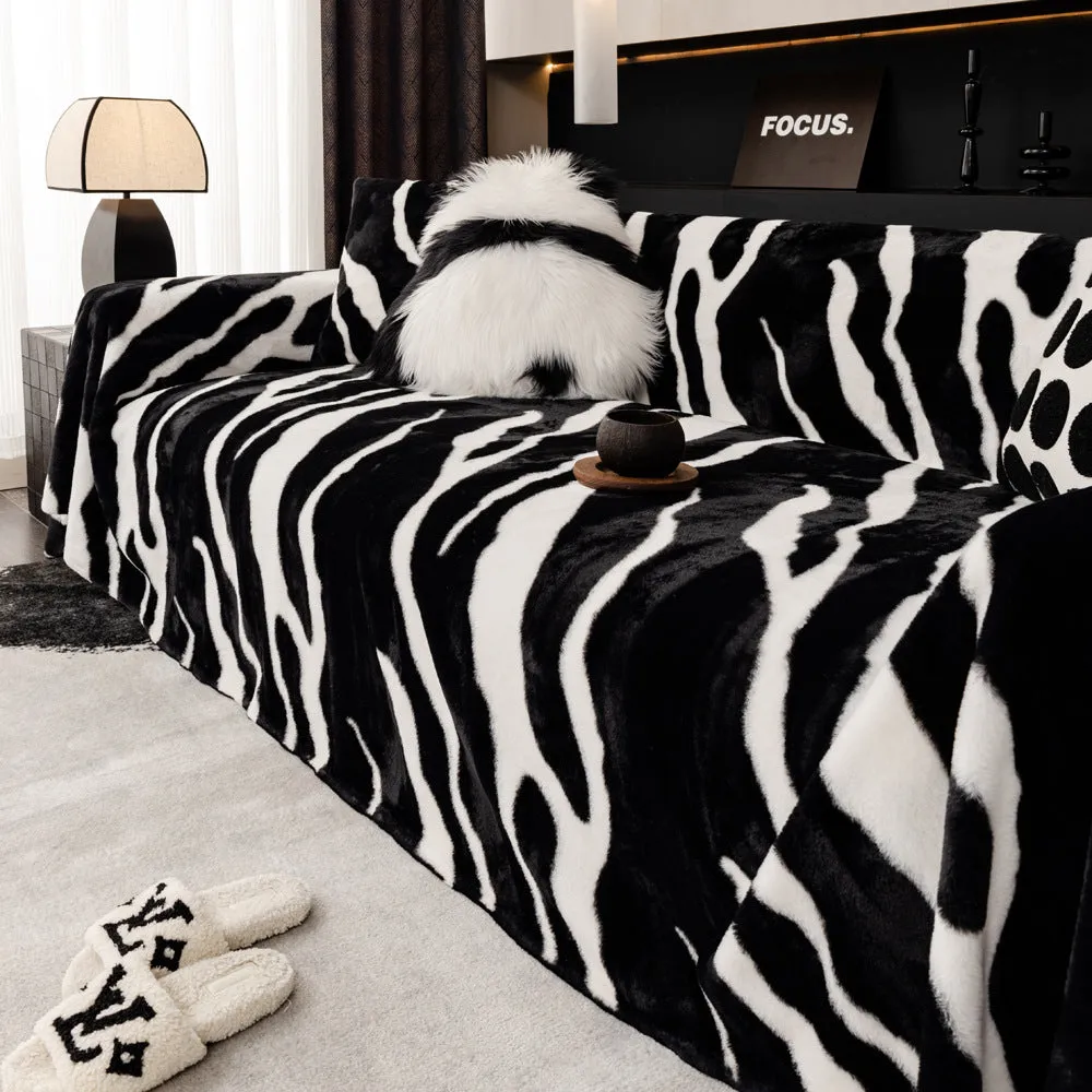Zebra pattern flannel sofa cover in caramel colour, laid flat showing its size and non-slip textured fabric.