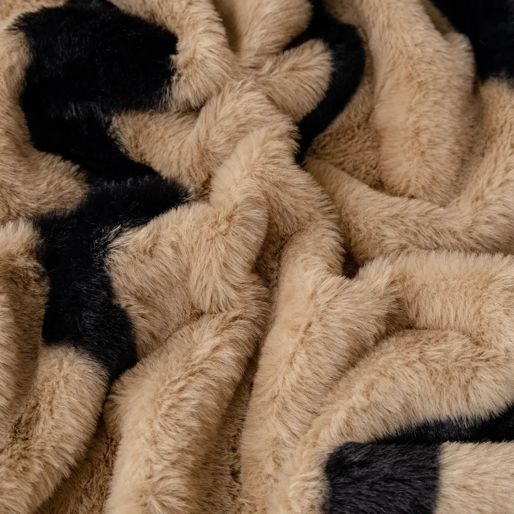 Zebra pattern flannel sofa cover in caramel colour, laid flat showing its size and non-slip textured fabric.