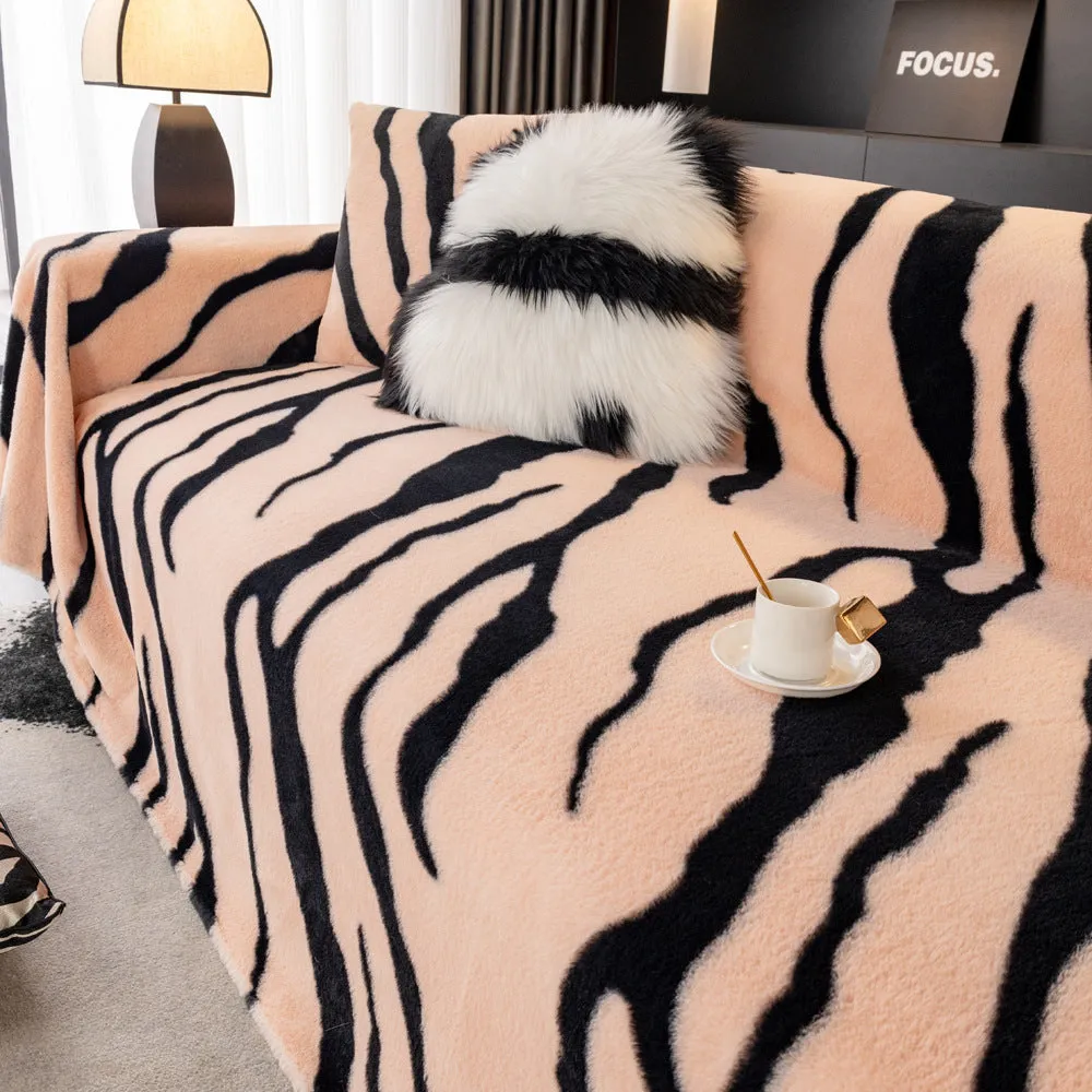 Zebra pattern flannel sofa cover in caramel colour, laid flat showing its size and non-slip textured fabric.