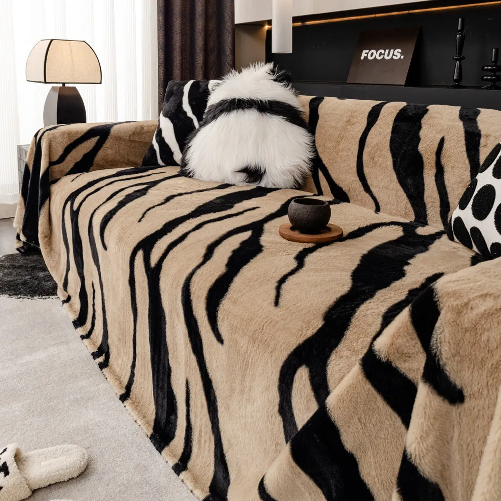 Zebra pattern flannel sofa cover in caramel colour, laid flat showing its size and non-slip textured fabric.