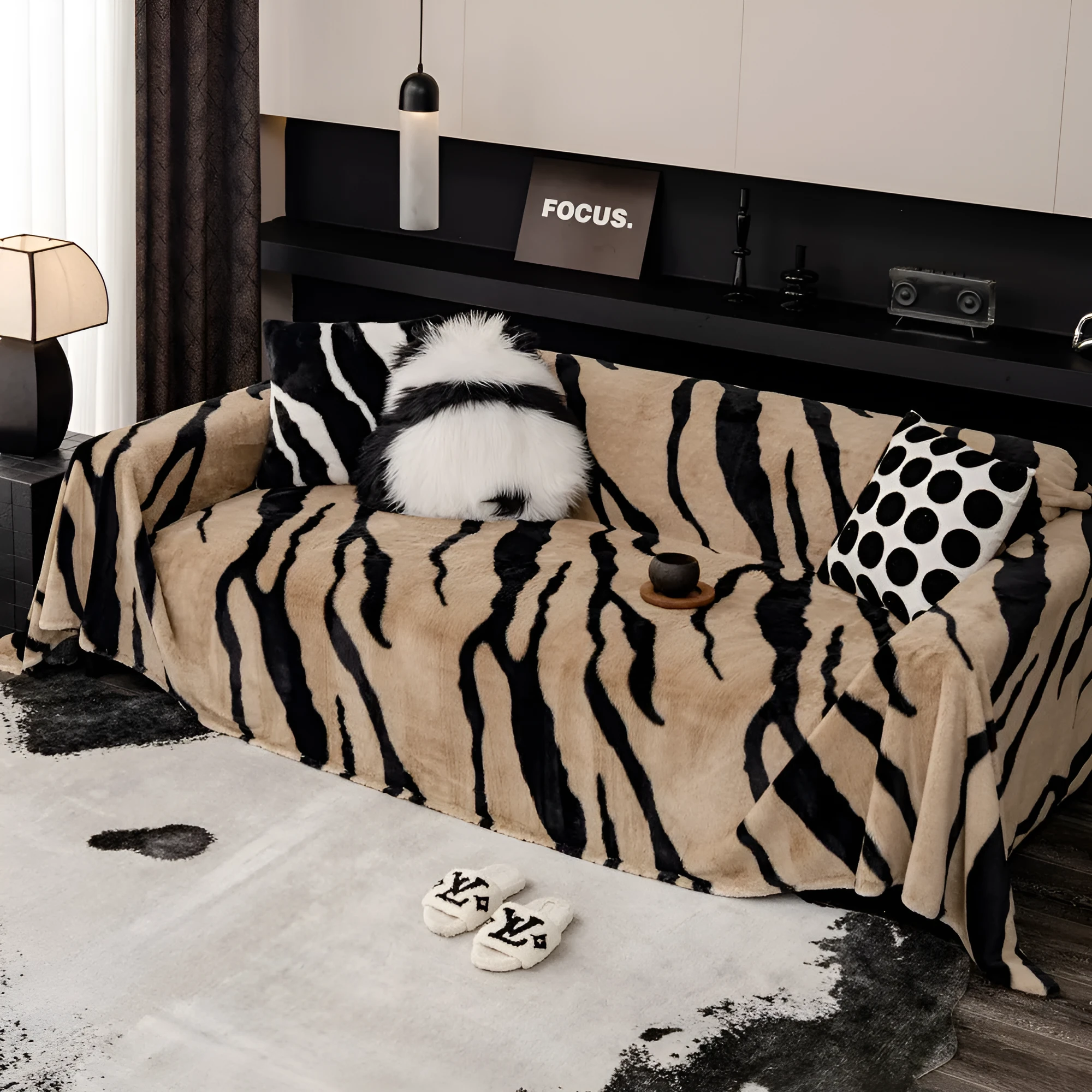 Zebra pattern flannel sofa cover in caramel colour, laid flat showing its size and non-slip textured fabric.