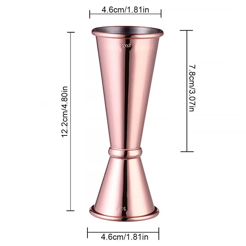 Double-headed stainless steel measuring cup and shaker on a bar counter for cocktail preparation