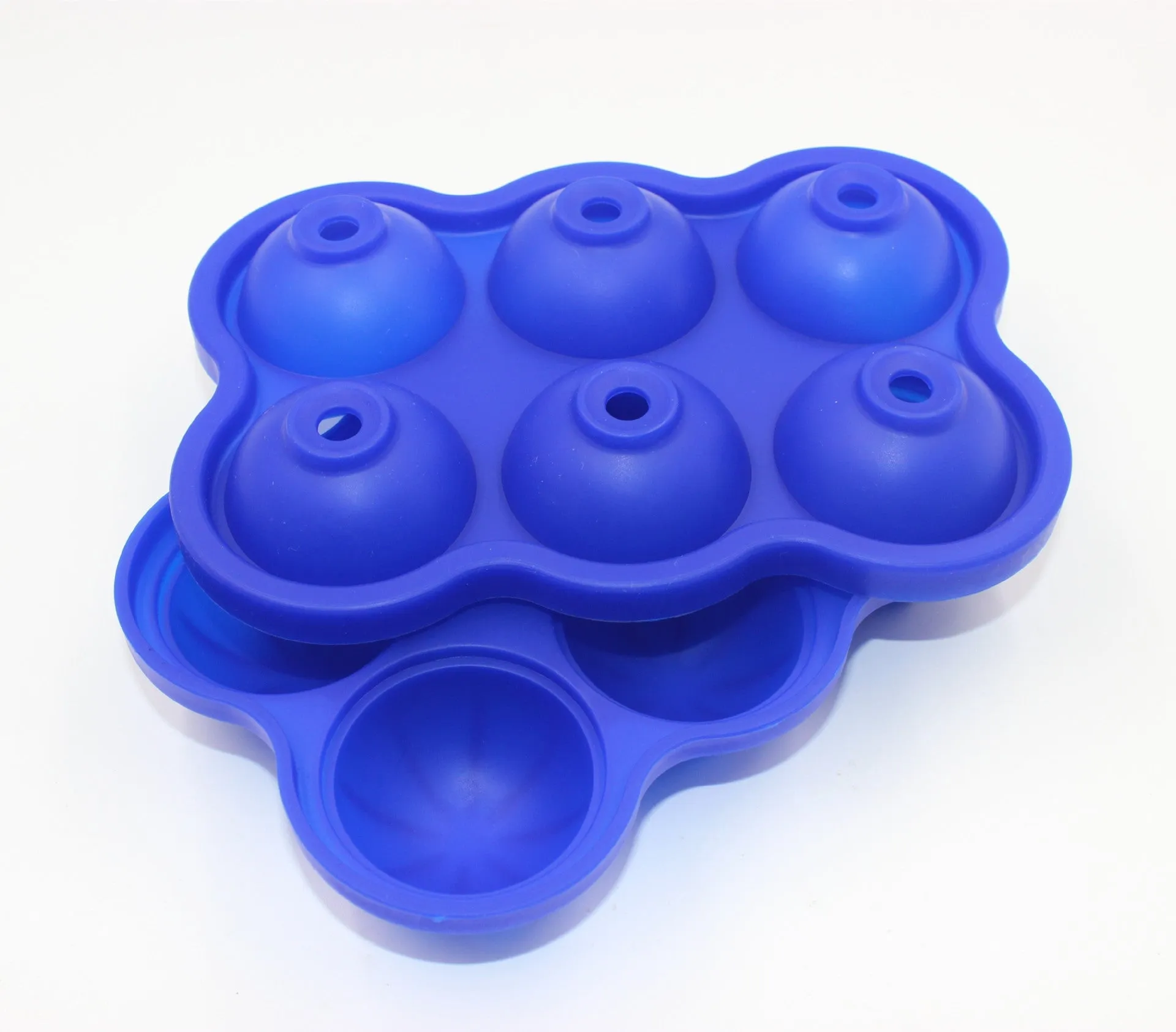 Large black silicone ice cube maker with six 4.5cm sphere cavities on a white background