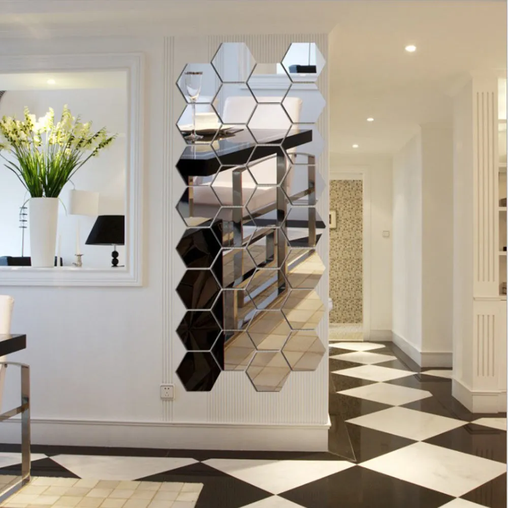 Hexagonal silver PS mirror wall sticker on a wall surface close up