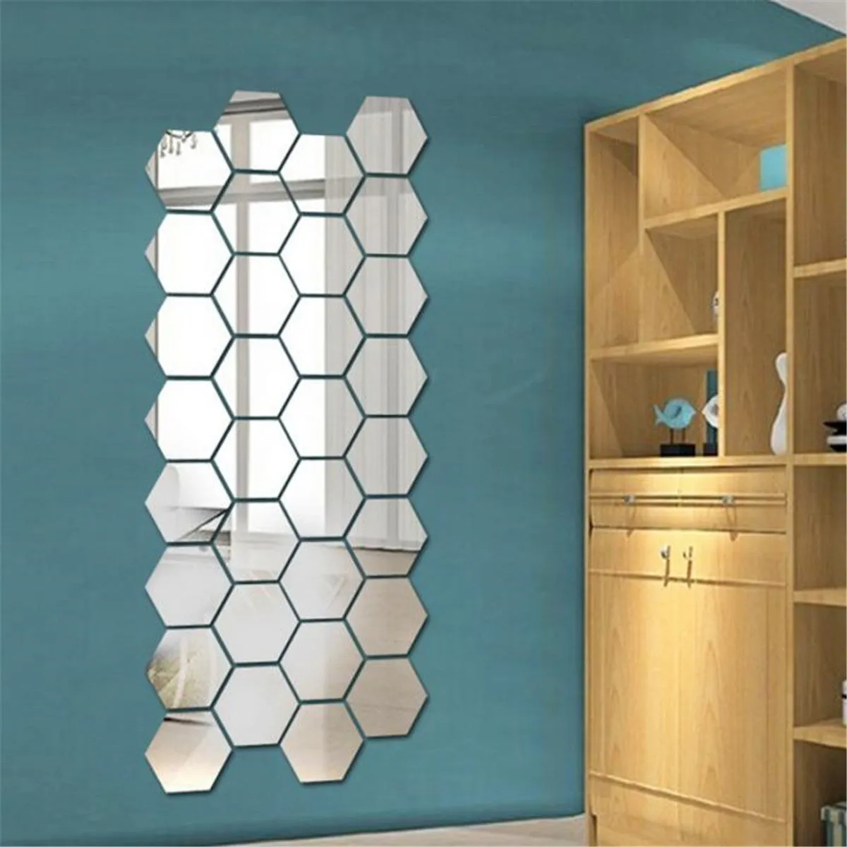 Hexagonal silver PS mirror wall sticker on a wall surface close up