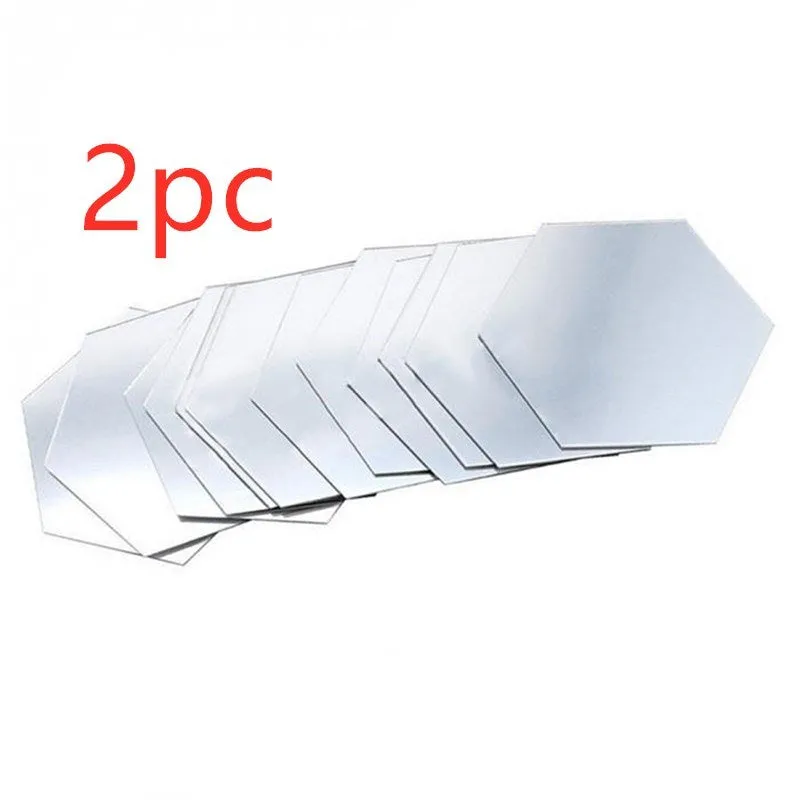 Hexagonal silver PS mirror wall sticker on a wall surface close up