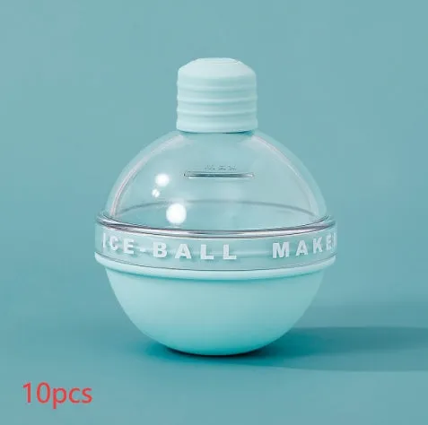 Blue spherical silicone ice ball mold producing a 6cm clear ice ball for whiskey, on a wooden table