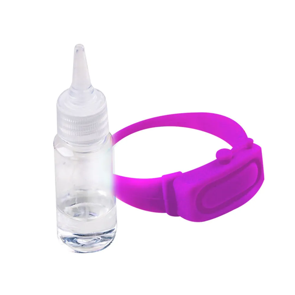 Portable hand sanitizer dispenser silicone wristband with refill cap, black band holding 6mL bottle