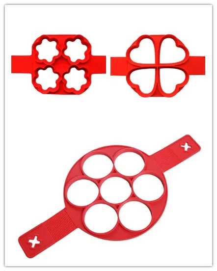 Red silicone egg mould set with heart, lace, round, square and 7-hole shapes on a white background