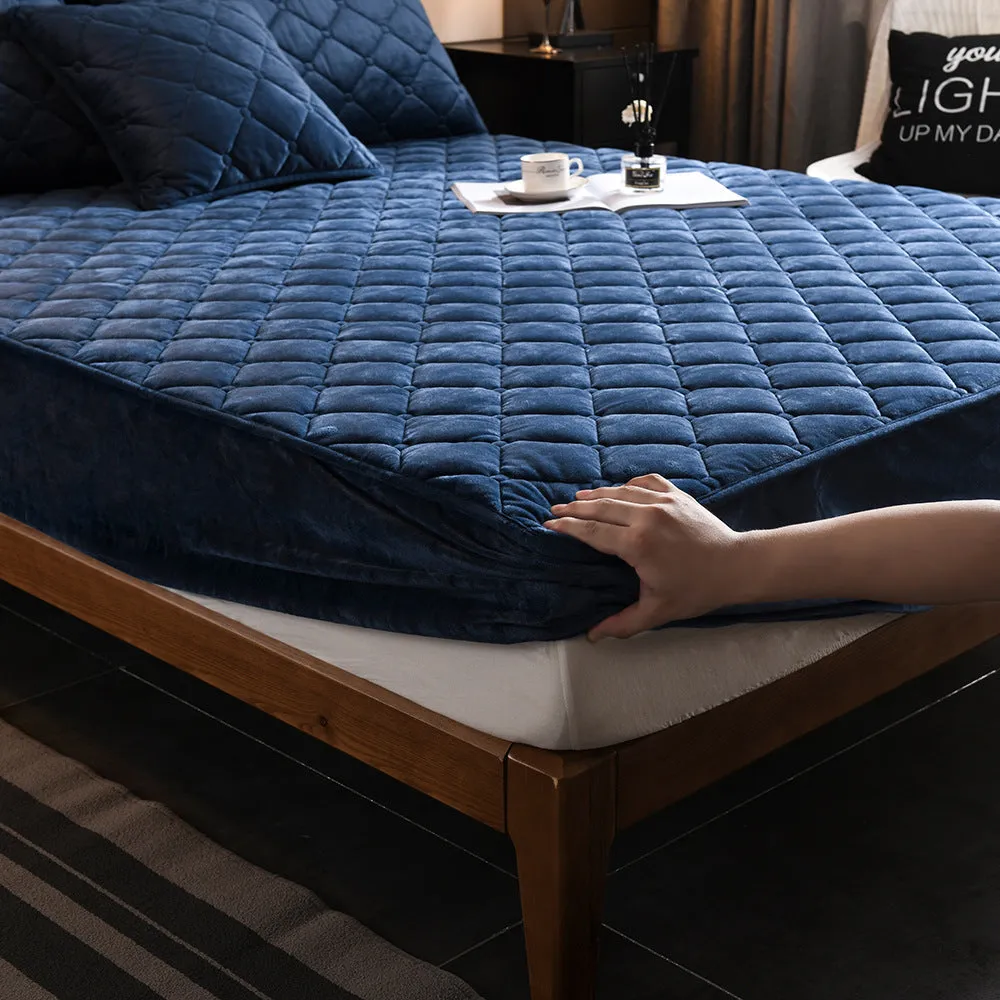 Crystal fleece padded bed cover in grey with quilted stitching and matching pillow case