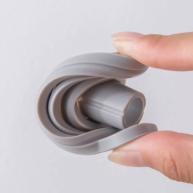 Creative silicone folding funnel in grey and white, collapsed flat on a kitchen surface
