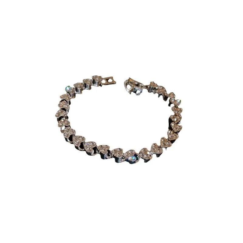 Silver metal bracelet with heart shape and inlaid zircon stones for women