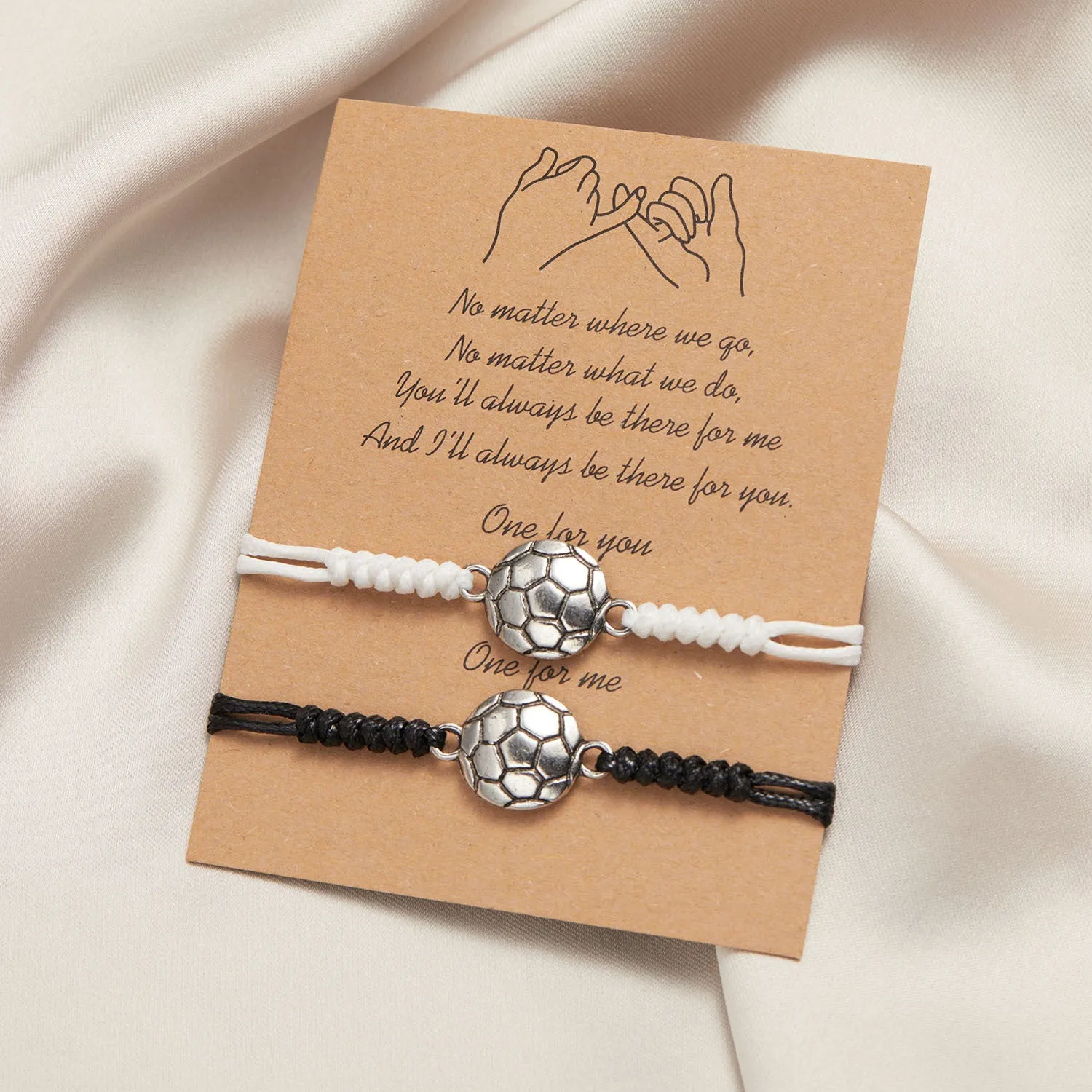 Black and white mixed colour alloy electroplated sports bracelet with geometric square shape on neutral background