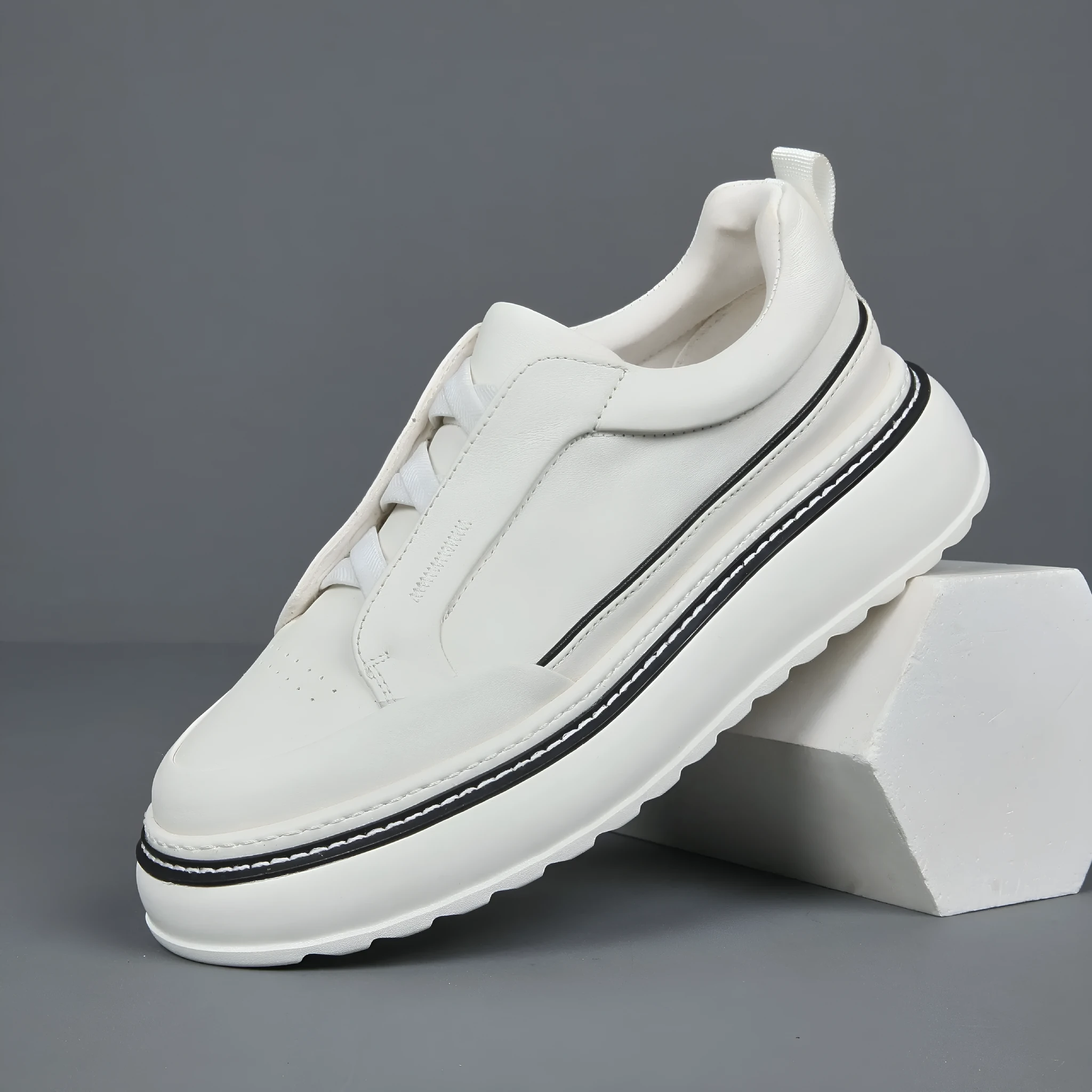 Black casual slip-on sneaker with leather upper, foam platform sole, and elastic band – side view