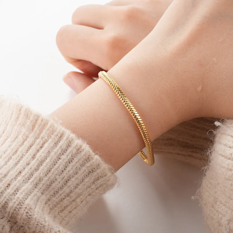 Stainless steel snake chain bracelet in silver tone, geometric line design with electroplated finish