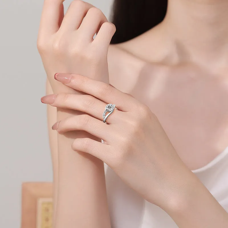 White gold colour crown-shaped copper ring on a plain background