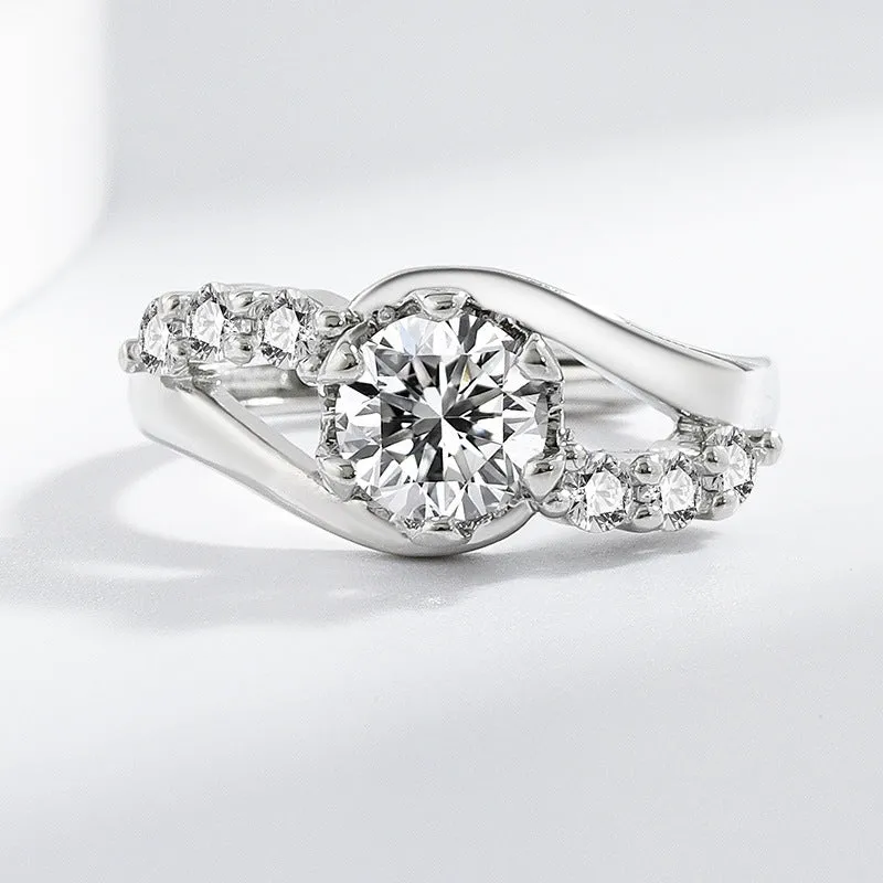 White gold colour crown-shaped copper ring on a plain background
