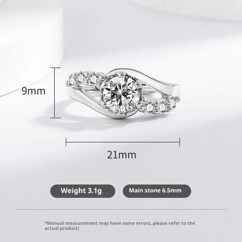 White gold colour crown-shaped copper ring on a plain background