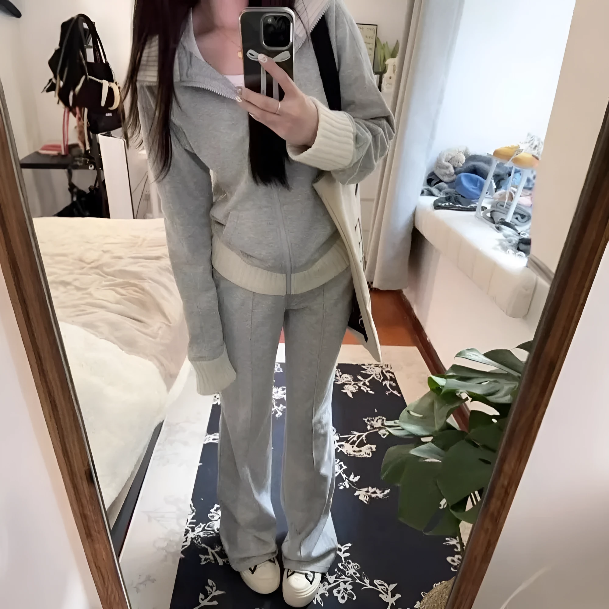 Women's light gray polyester two-piece set consisting of a pocket coat and wide leg trousers, shown flat lay view.