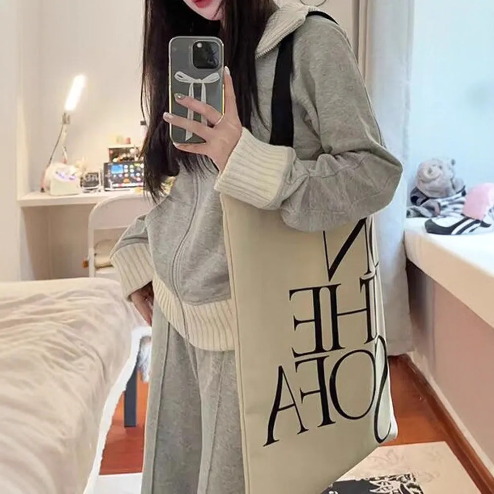 Women's light gray polyester two-piece set consisting of a pocket coat and wide leg trousers, shown flat lay view.